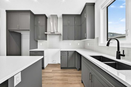 5001 Harmony Circle, Rural Rocky View County, AB - Indoor Photo Showing Kitchen With Double Sink