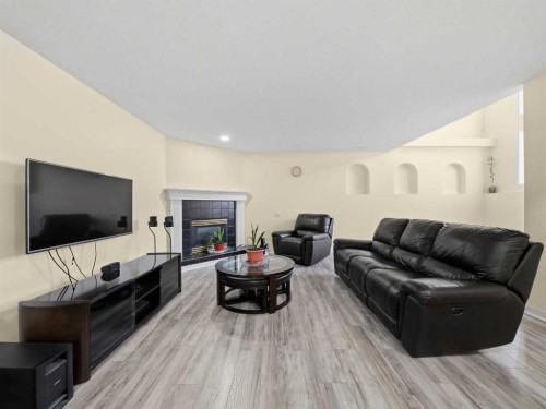 109 Somerset Close Sw, Calgary, AB - Indoor Photo Showing Living Room With Fireplace