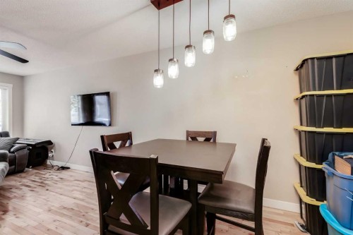 306-2445 Kingsland Road Se, Airdrie, AB - Indoor Photo Showing Dining Room