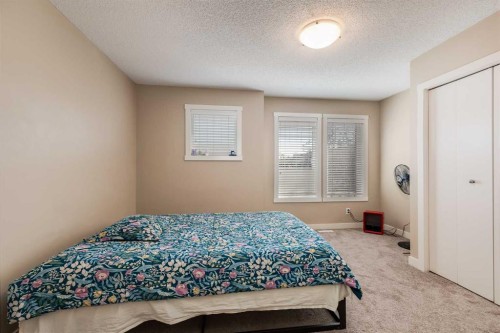 306-2445 Kingsland Road Se, Airdrie, AB - Indoor Photo Showing Bedroom