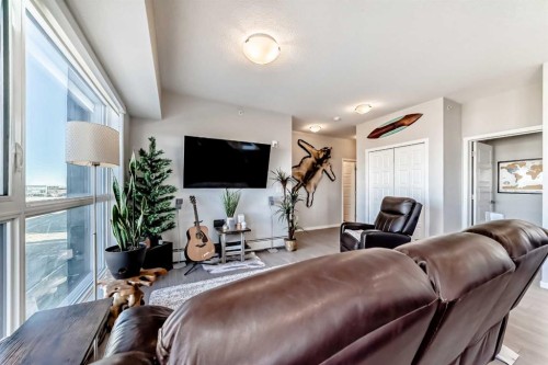 409-4150 Seton Drive Se, Calgary, AB - Indoor Photo Showing Living Room