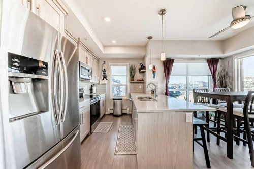 409-4150 Seton Drive Se, Calgary, AB - Indoor Photo Showing Kitchen With Double Sink With Upgraded Kitchen