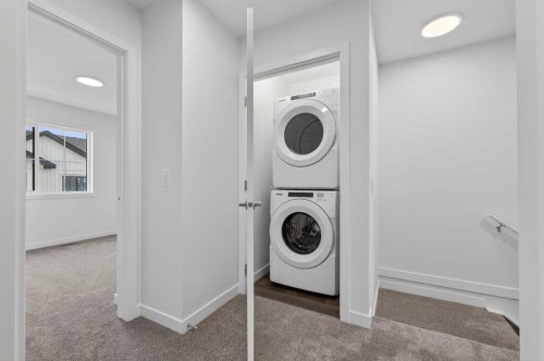 56 Creekside Drive Sw, Calgary, AB - Indoor Photo Showing Laundry Room
