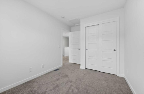 56 Creekside Drive Sw, Calgary, AB - Indoor Photo Showing Other Room