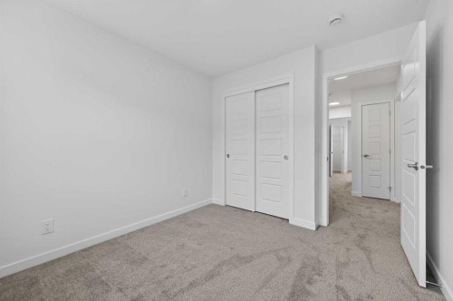 56 Creekside Drive Sw, Calgary, AB - Indoor Photo Showing Other Room