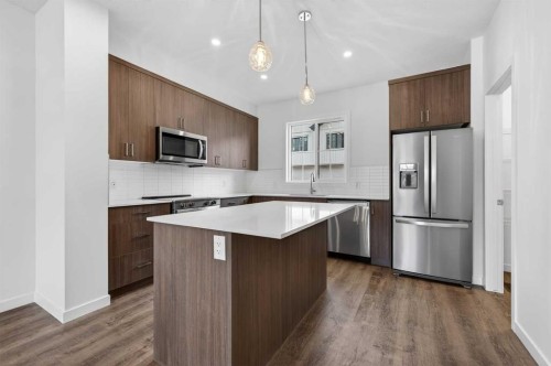56 Creekside Drive Sw, Calgary, AB - Indoor Photo Showing Kitchen With Stainless Steel Kitchen With Upgraded Kitchen