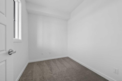 56 Creekside Drive Sw, Calgary, AB - Indoor Photo Showing Other Room