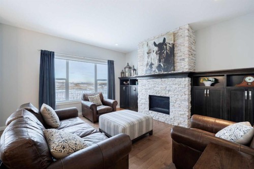 155 Crestridge Hill Sw, Calgary, AB - Indoor Photo Showing Living Room With Fireplace