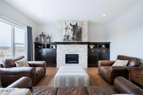 155 Crestridge Hill Sw, Calgary, AB - Indoor Photo Showing Living Room With Fireplace