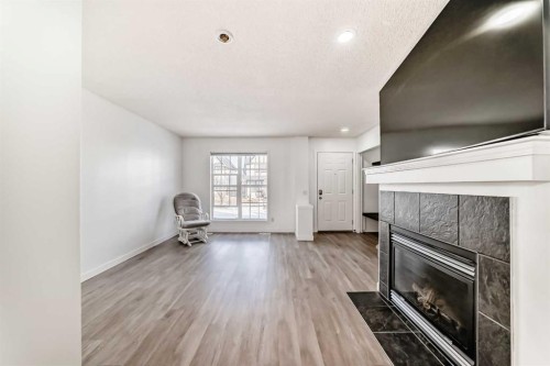 294 Elgin View Se, Calgary, AB - Indoor Photo Showing Living Room With Fireplace