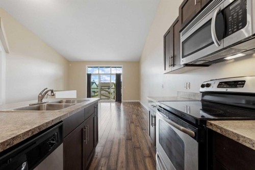 2203-230 Eversyde Boulevard Sw, Calgary, AB - Indoor Photo Showing Kitchen With Double Sink