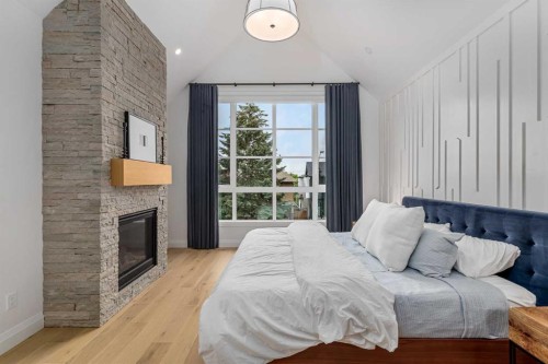 2032 41 Avenue Sw, Calgary, AB - Indoor Photo Showing Bedroom With Fireplace