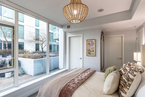 205-519 Riverfront Avenue Se, Calgary, AB - Indoor Photo Showing Bedroom