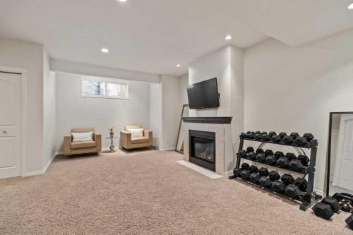 18 Simcoe Terrace Sw, Calgary, AB - Indoor With Fireplace