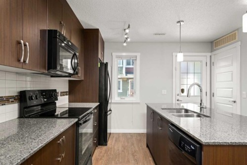 509 Auburn Bay Circle Se, Calgary, AB - Indoor Photo Showing Kitchen With Double Sink With Upgraded Kitchen