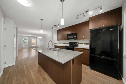 509 Auburn Bay Circle Se, Calgary, AB - Indoor Photo Showing Kitchen With Double Sink