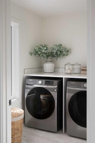 28 Sunvalley View, Cochrane, AB - Indoor Photo Showing Laundry Room