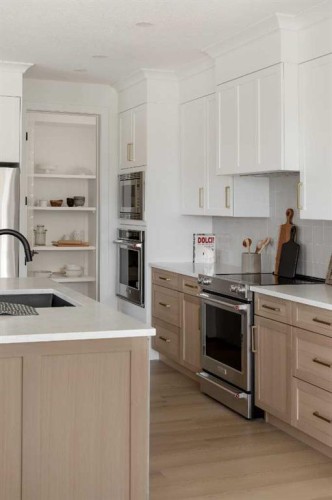 28 Sunvalley View, Cochrane, AB - Indoor Photo Showing Kitchen With Stainless Steel Kitchen With Upgraded Kitchen