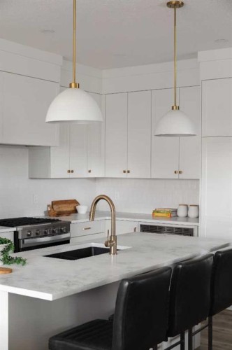 88 Sunrise Heath, Cochrane, AB - Indoor Photo Showing Kitchen With Upgraded Kitchen