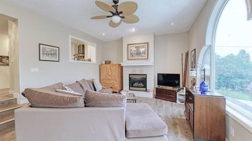 7508 7 Street Nw, Calgary, AB - Indoor Photo Showing Living Room With Fireplace