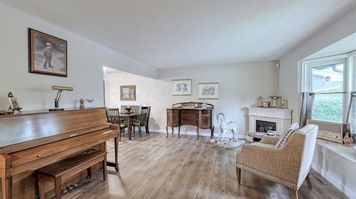 7508 7 Street Nw, Calgary, AB - Indoor Photo Showing Living Room With Fireplace