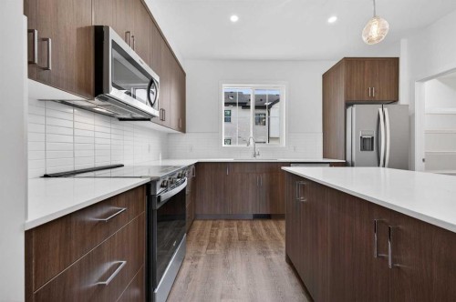 64 Creekside Drive Sw, Calgary, AB - Indoor Photo Showing Kitchen With Stainless Steel Kitchen With Upgraded Kitchen