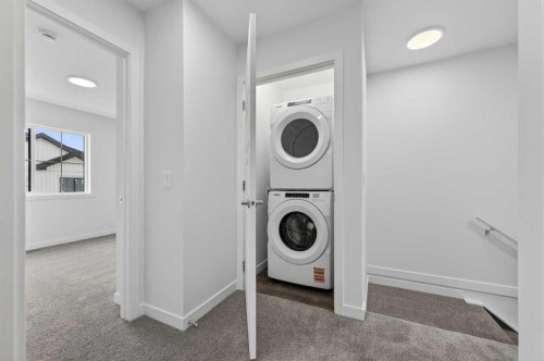 64 Creekside Drive Sw, Calgary, AB - Indoor Photo Showing Laundry Room