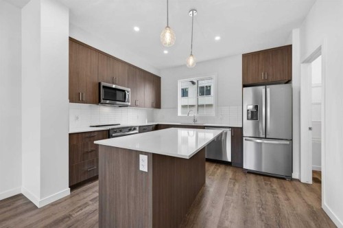 64 Creekside Drive Sw, Calgary, AB - Indoor Photo Showing Kitchen With Stainless Steel Kitchen With Upgraded Kitchen