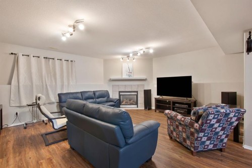 40 Douglas Close, Penhold, AB - Indoor Photo Showing Living Room With Fireplace