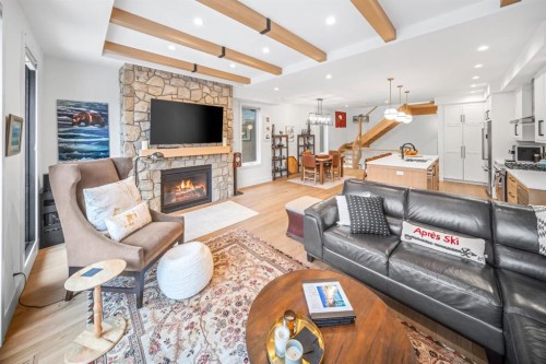 4-810 3Rd Street, Canmore, AB - Indoor Photo Showing Living Room With Fireplace