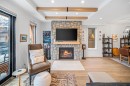 4-810 3Rd Street, Canmore, AB  - Indoor Photo Showing Living Room With Fireplace 