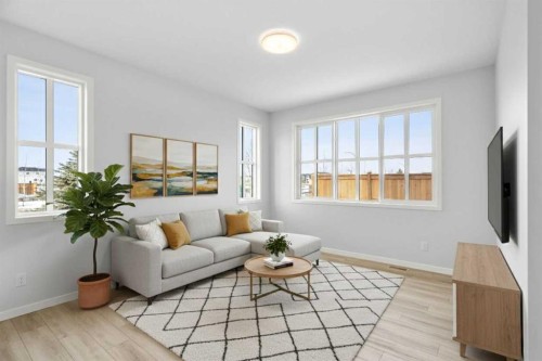 659 Buffaloberry Manor Se, Calgary, AB - Indoor Photo Showing Living Room