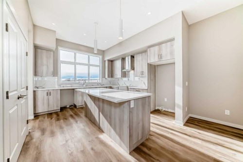 123 Sawgrass Gate Nw, Airdrie, AB - Indoor Photo Showing Kitchen With Upgraded Kitchen