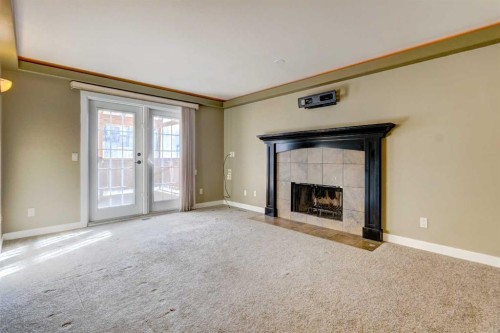 83 Hawkfield Crescent Nw, Calgary, AB - Indoor With Fireplace