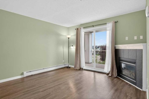 4316-10 Prestwick Bay Se, Calgary, AB - Indoor With Fireplace