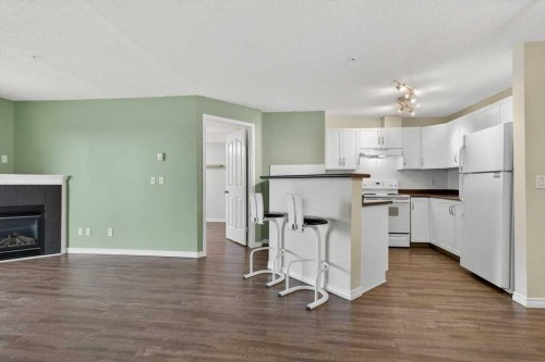 4316-10 Prestwick Bay Se, Calgary, AB - Indoor With Fireplace
