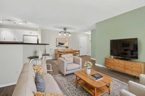 4316-10 Prestwick Bay Se, Calgary, AB - Indoor Photo Showing Living Room