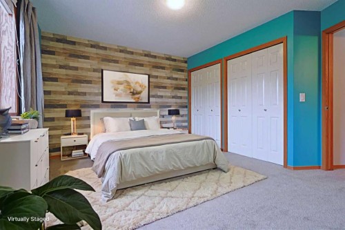 19 Sunridge Crescent Nw, Airdrie, AB - Indoor Photo Showing Bedroom