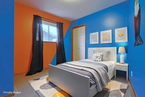 19 Sunridge Crescent Nw, Airdrie, AB - Indoor Photo Showing Bedroom