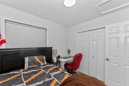 247 Taracove Estate Drive Ne, Calgary, AB - Indoor Photo Showing Bedroom