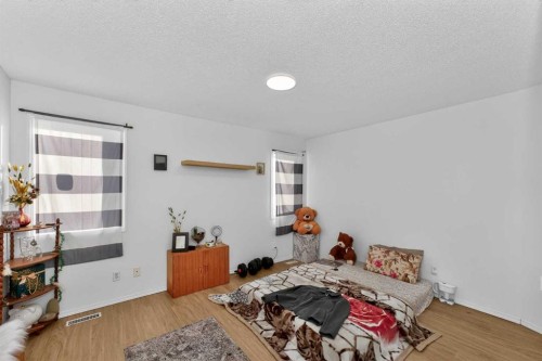 247 Taracove Estate Drive Ne, Calgary, AB - Indoor Photo Showing Bedroom