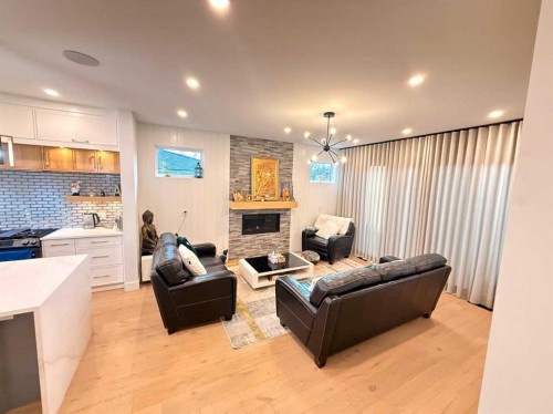 103 Hartford Road Nw, Calgary, AB - Indoor Photo Showing Other Room With Fireplace