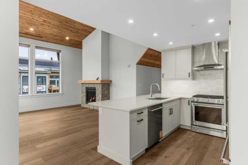 407-1505 Spring Creek Gate, Canmore, AB - Indoor Photo Showing Kitchen With Upgraded Kitchen