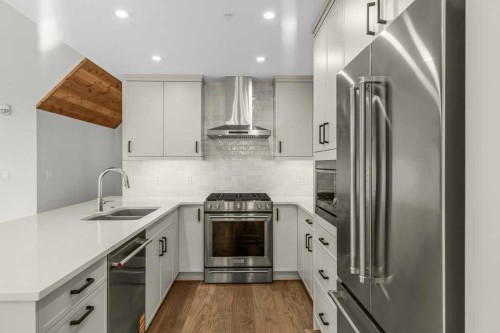 407-1505 Spring Creek Gate, Canmore, AB - Indoor Photo Showing Kitchen With Double Sink With Upgraded Kitchen