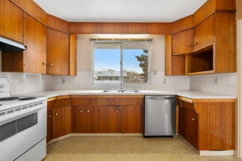2719 Chalice Road Nw, Calgary, AB - Indoor Photo Showing Kitchen With Double Sink