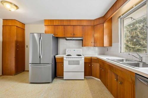 2719 Chalice Road Nw, Calgary, AB - Indoor Photo Showing Kitchen With Double Sink