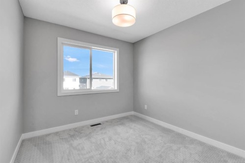 157 Dawson Wharf View, Chestermere, AB - Indoor Photo Showing Other Room