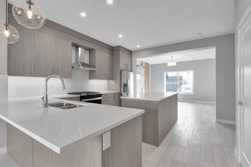157 Dawson Wharf View, Chestermere, AB - Indoor Photo Showing Kitchen With Double Sink With Upgraded Kitchen
