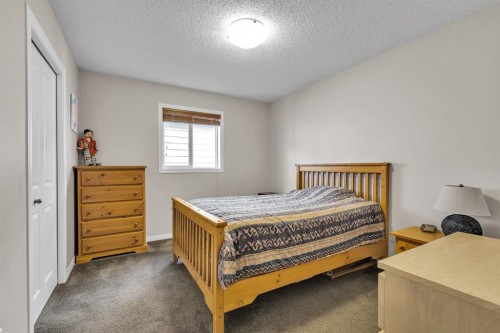 31 Walden Court Se, Calgary, AB - Indoor Photo Showing Bedroom