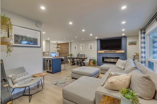 1324 Lake Sylvan Drive Se, Calgary, AB - Indoor Photo Showing Living Room With Fireplace